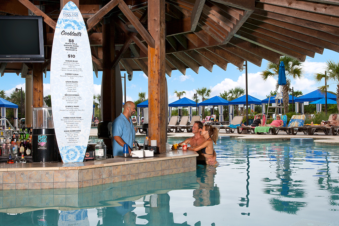 Swim-up Pool Bar and couple standing at the bar