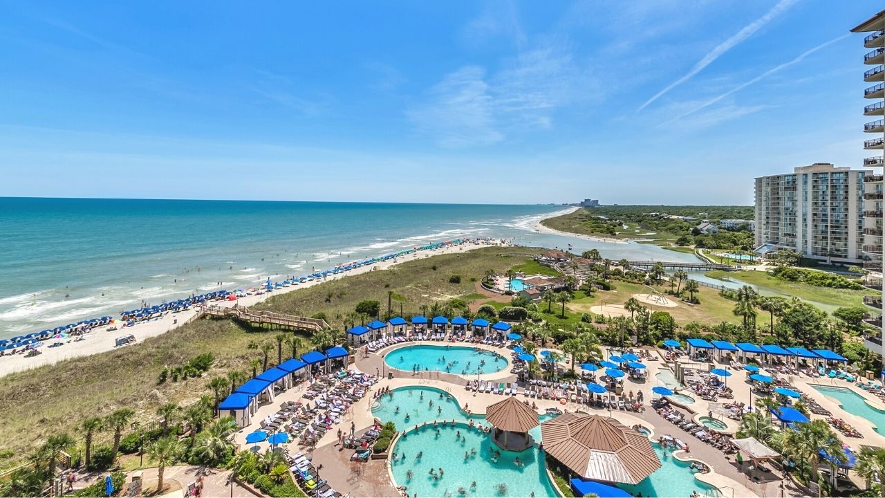 Balcony view of coastline and the pool deck at North Beach