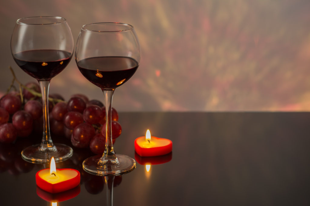 Wine glasses with candles