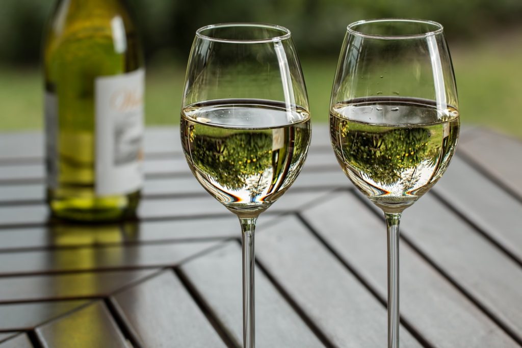 two wine glasses on table