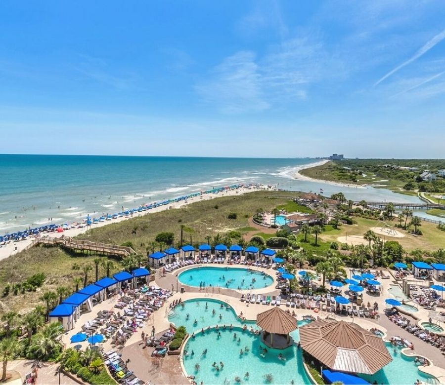 Balcony view of coastline and the pool deck at North Beach