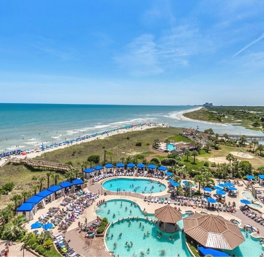Balcony view of coastline and the pool deck at North Beach