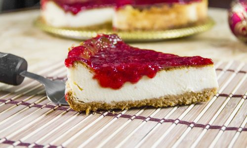 cheesecake piece of cheesecake being served