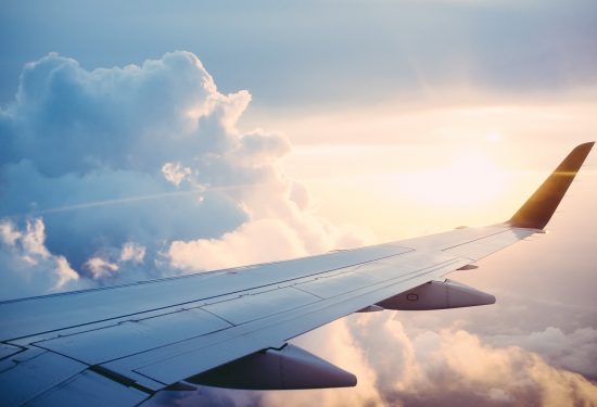 airplane flying through the clouds